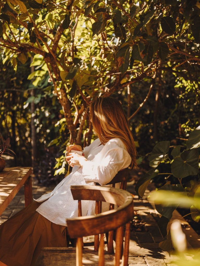 A guest resting in the forest after a treatment